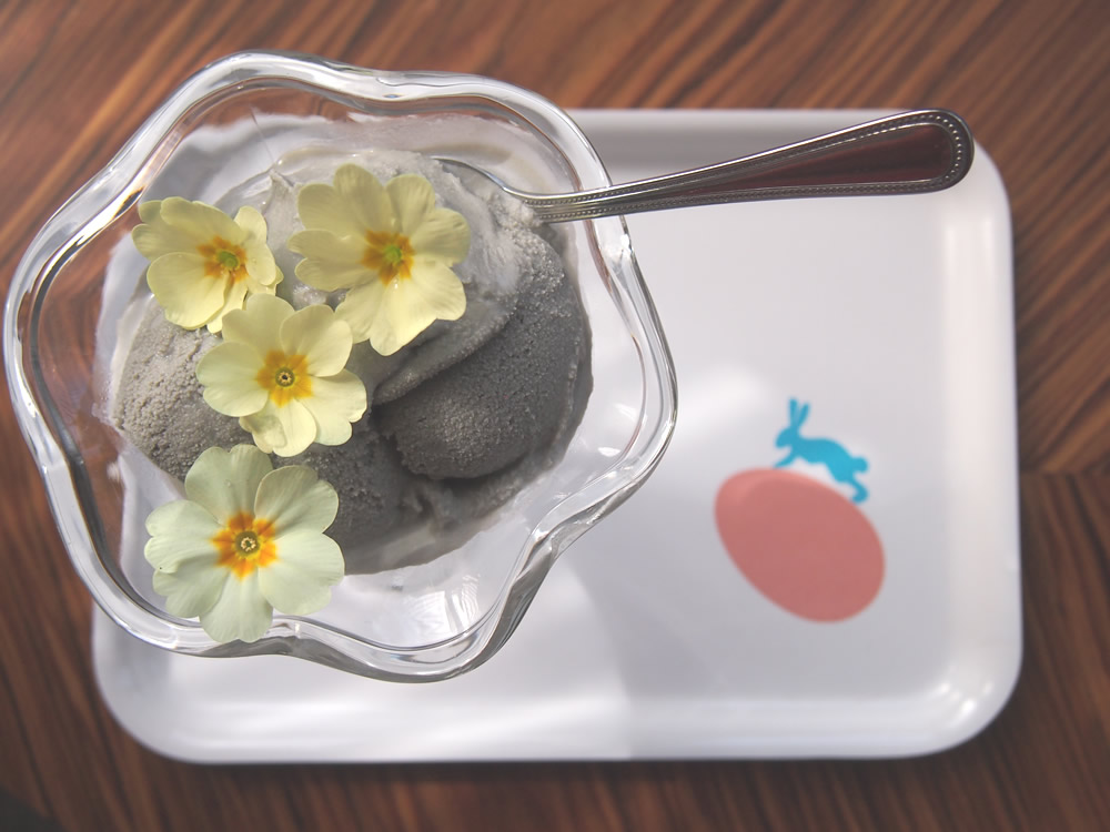 Edible primrose flowers with liquorice ice cream